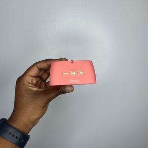 A pink small Sonix Bluetooth speaker for outdoors and indoors.
